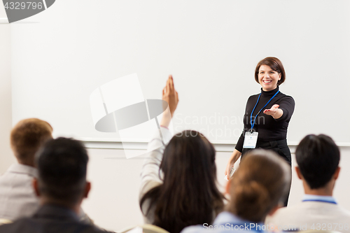 Image of group of people at business conference or lecture