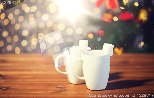 Image of cups of hot chocolate with marshmallow on wood