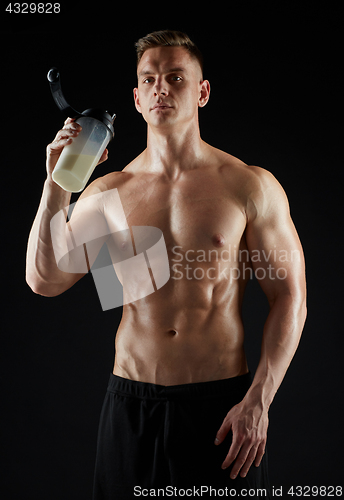 Image of young man or bodybuilder with protein shake bottle