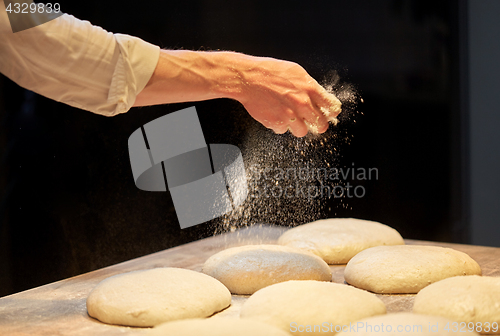 Image of chef or baker making bread dough at bakery