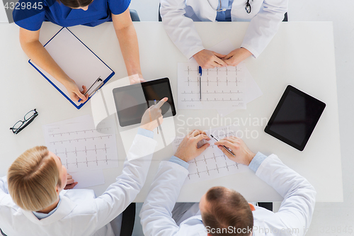 Image of doctors with cardiogram and tablet pc at hospital