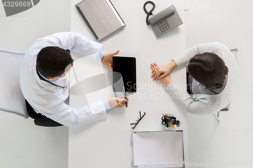 Image of doctor and young woman meeting at hospital