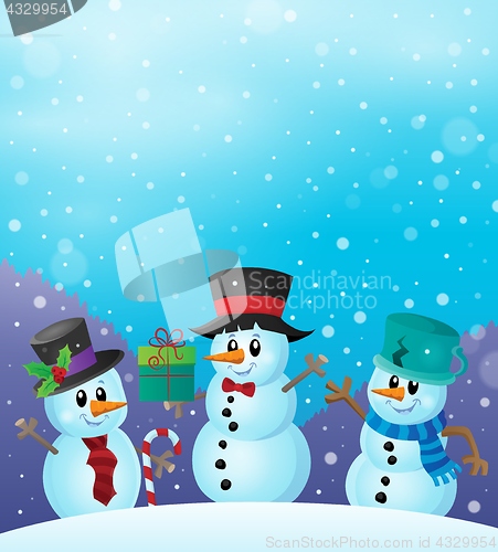 Image of Christmas snowmen in snowy weather