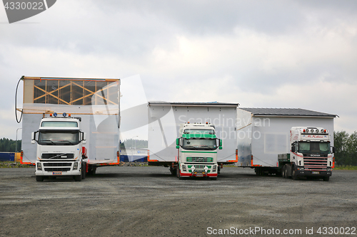 Image of Three Oversize Load Transports in a Row