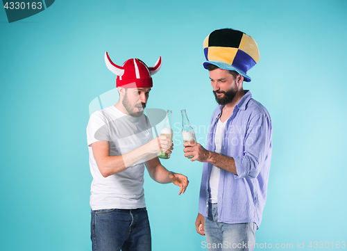 Image of Two Excited Male Friends Celebrate Watching Sports