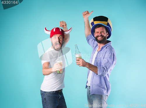 Image of Two Excited Male Friends Celebrate Watching Sports