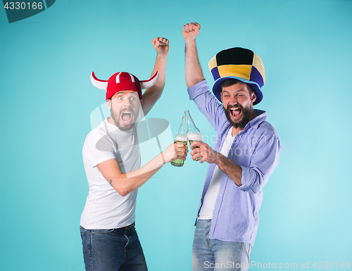 Image of Two Excited Male Friends Celebrate Watching Sports