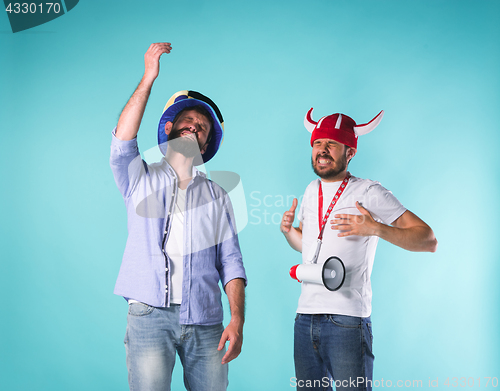 Image of The two football fans over blue