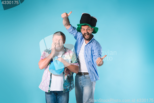 Image of The two football fans over blue