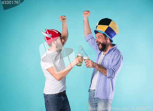 Image of Two Excited Male Friends Celebrate Watching Sports