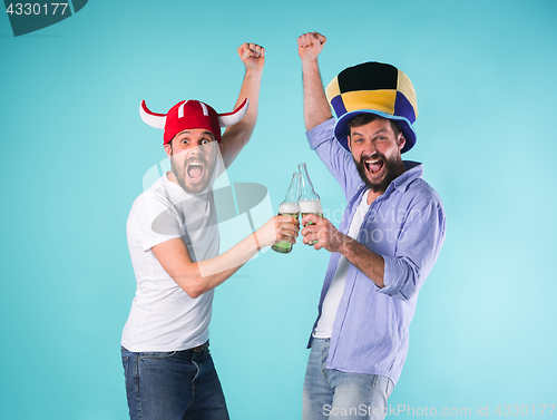 Image of Two Excited Male Friends Celebrate Watching Sports