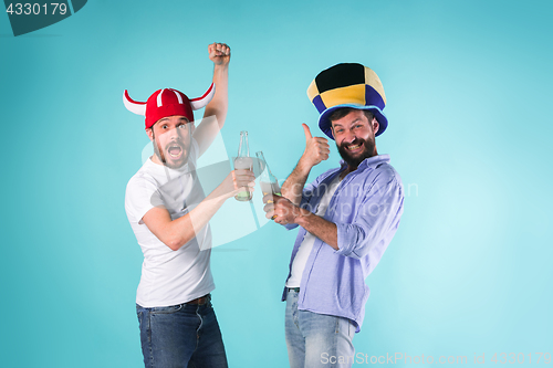 Image of Two Excited Male Friends Celebrate Watching Sports