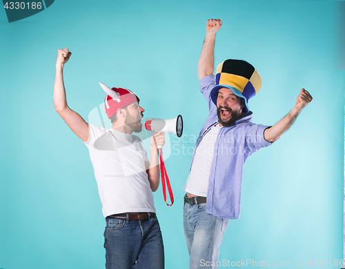 Image of Two Excited Male Friends Celebrate Watching Sports