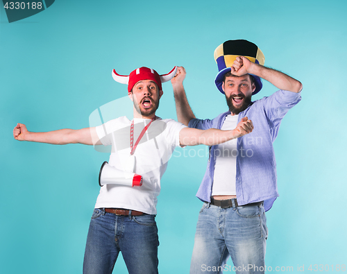 Image of Two Excited Male Friends Celebrate Watching Sports