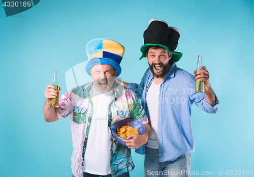 Image of The two football fans over blue