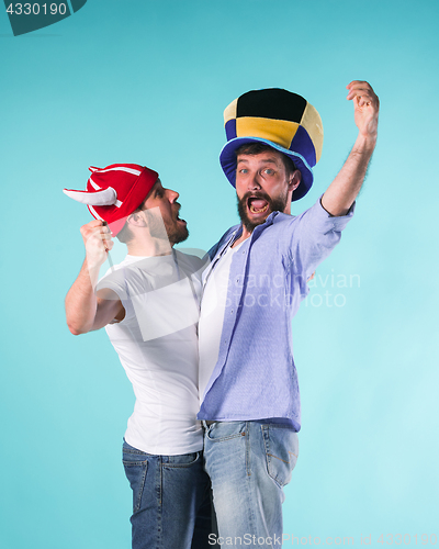 Image of Two Excited Male Friends Celebrate Watching Sports