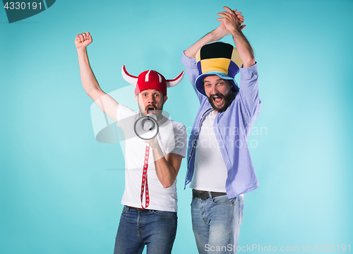 Image of Two Excited Male Friends Celebrate Watching Sports