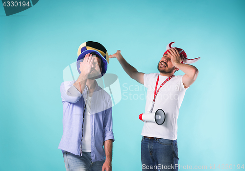 Image of Two Excited Male Friends Celebrate Watching Sports
