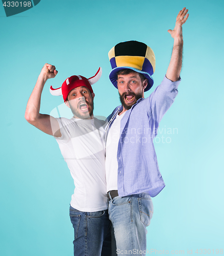 Image of Two Excited Male Friends Celebrate Watching Sports