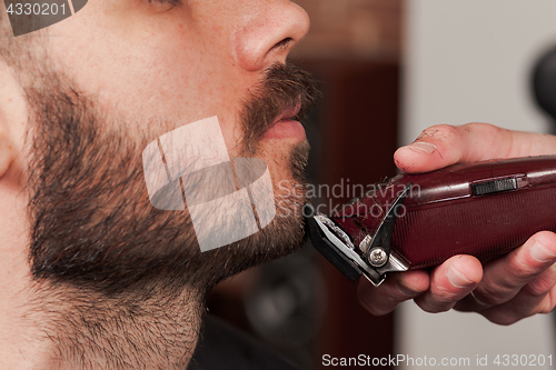 Image of Hipster client visiting barber shop