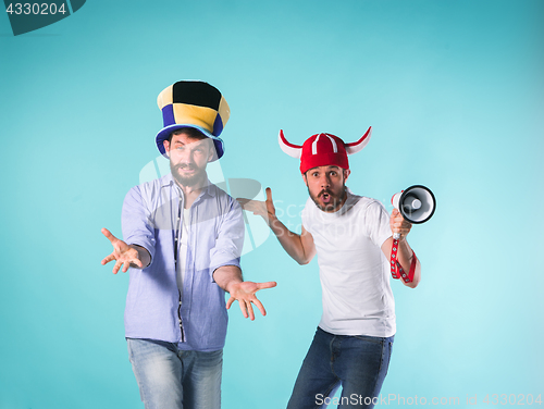 Image of Two Excited Male Friends Celebrate Watching Sports