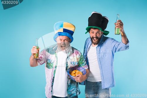 Image of The two football fans over blue