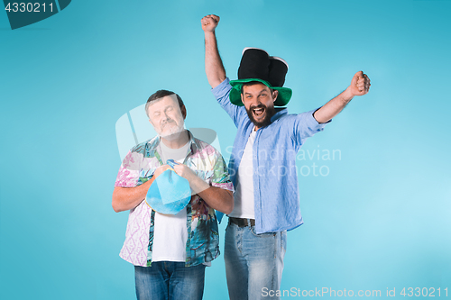 Image of The two football fans over blue