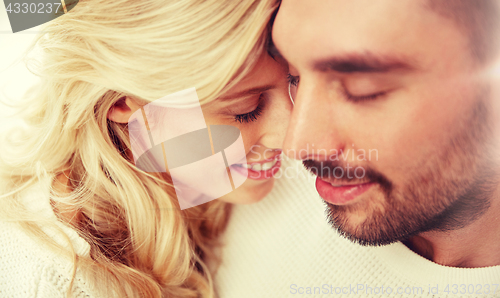 Image of close up of happy couple faces with closed eyes