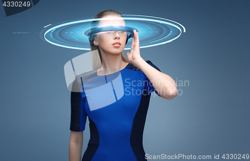 Image of woman in virtual reality 3d glasses with hologram