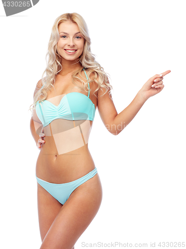 Image of happy smiling young woman in bikini swimsuit