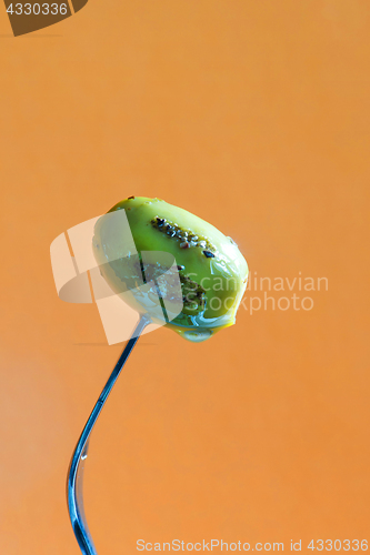 Image of Grilled olive on the fork