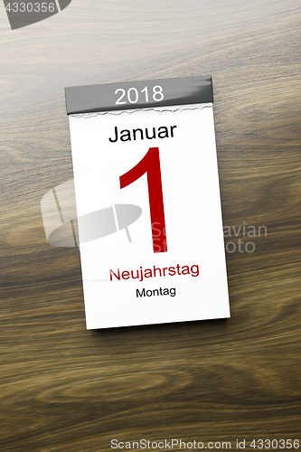 Image of a calendar the 1st of January new year day text in german langua