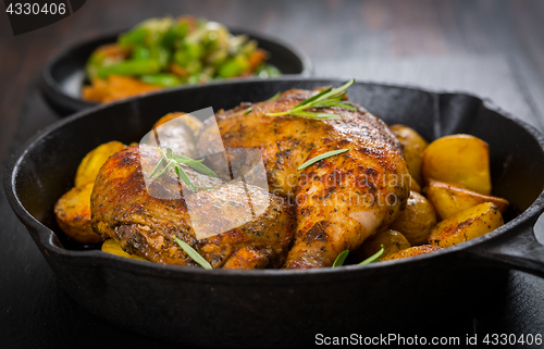 Image of Baked chicken legs with potatos