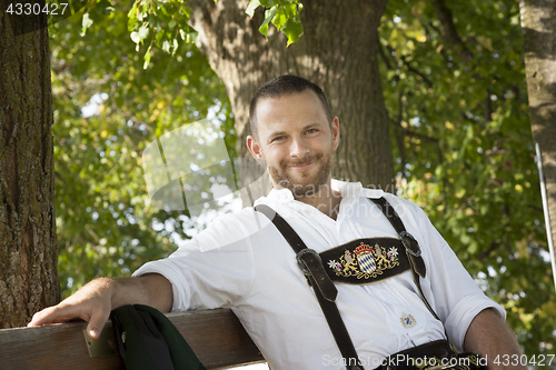 Image of bavarian tradition man in the grass