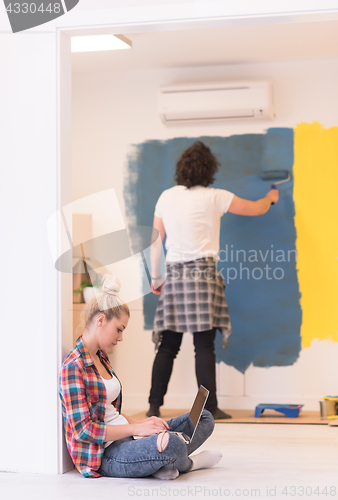 Image of Happy couple doing home renovations