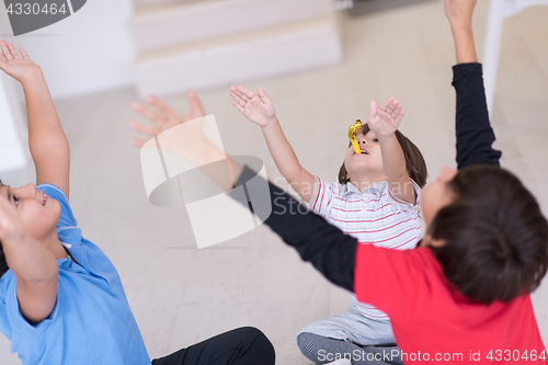 Image of young boys having fun on the floor