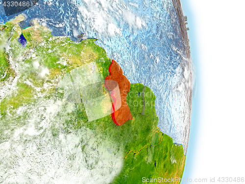 Image of Guyana in red on Earth