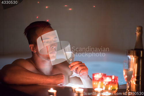 Image of man relaxing in the jacuzzi