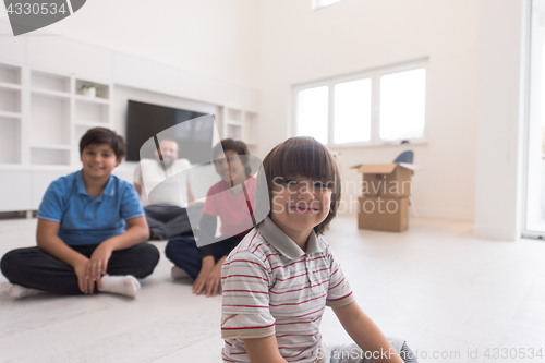 Image of portrait of happy young boys with their dad