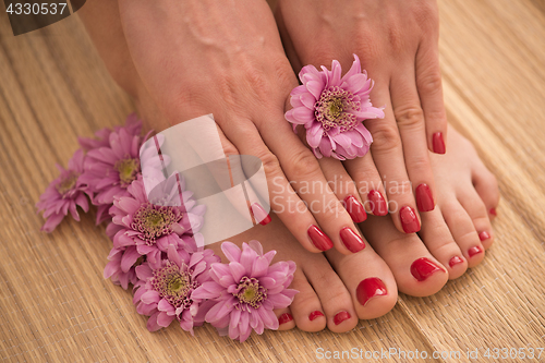 Image of female feet and hands at spa salon