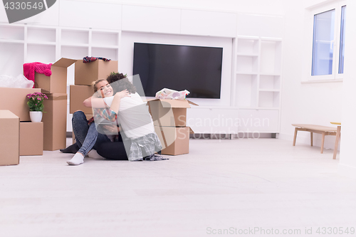 Image of young couple moving  in new house