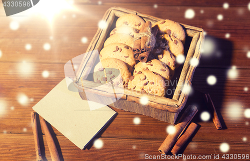 Image of close up of oat cookies and card  on wooden table