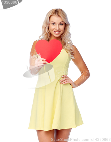 Image of happy young woman with red paper heart