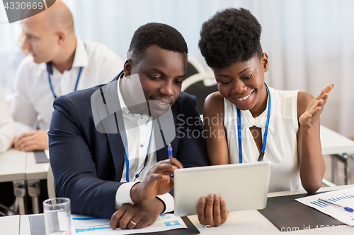 Image of team with tablet pc at business conference