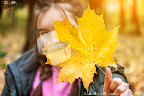 Image of Young girl in a blurry background