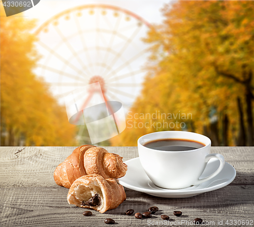 Image of Cup of coffee with croissants