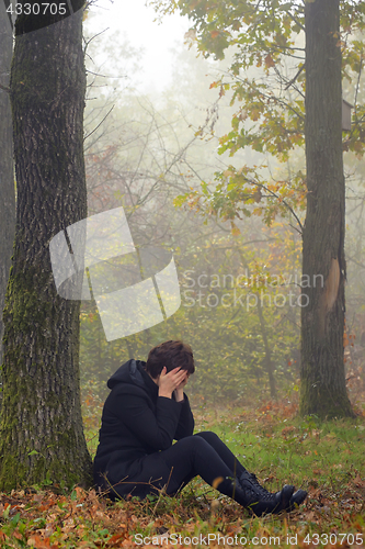 Image of woman in depression in forest