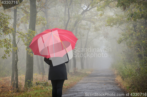 Image of Woman with red umbrella 