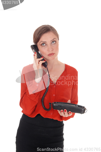 Image of Business woman holding her old phone.