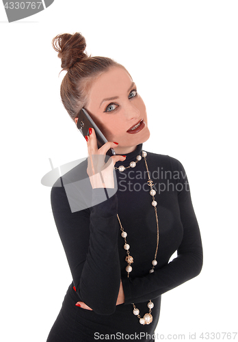 Image of Business woman talking on cell phone.
